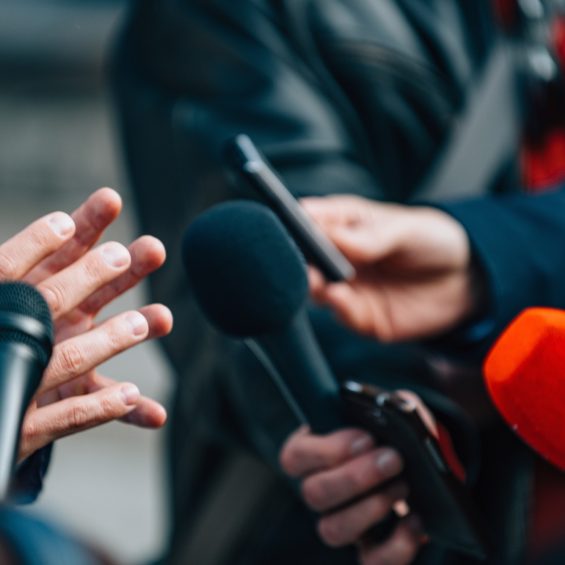 Interviewing businessman on press conference