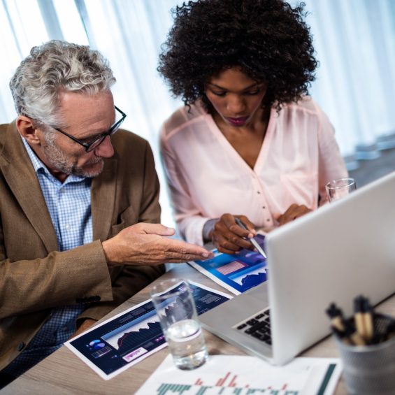 Two businessmen working on a computer